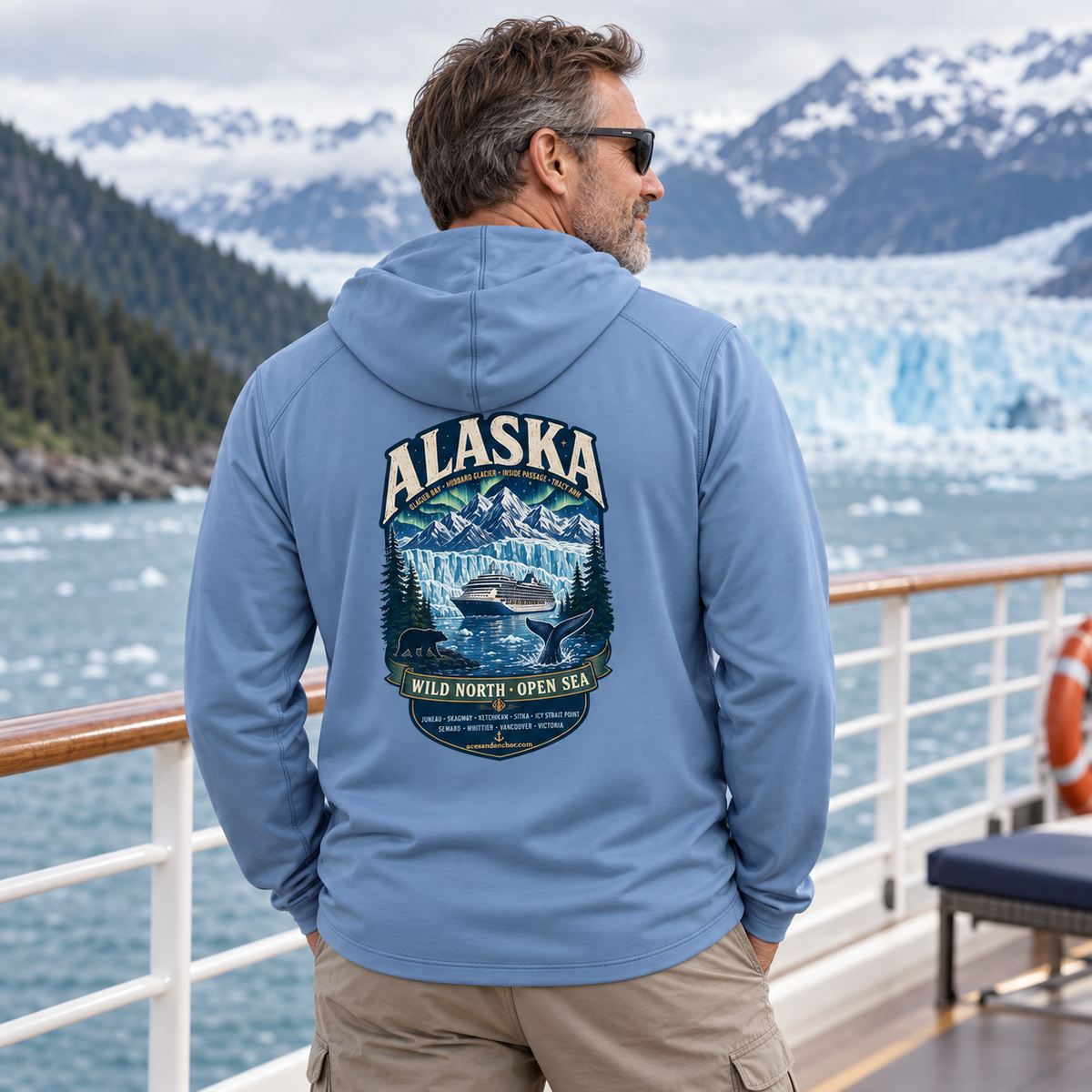 Man wearing Columbia blue Aces & Anchor Alaska performance hoodie on an Alaska cruise ship
