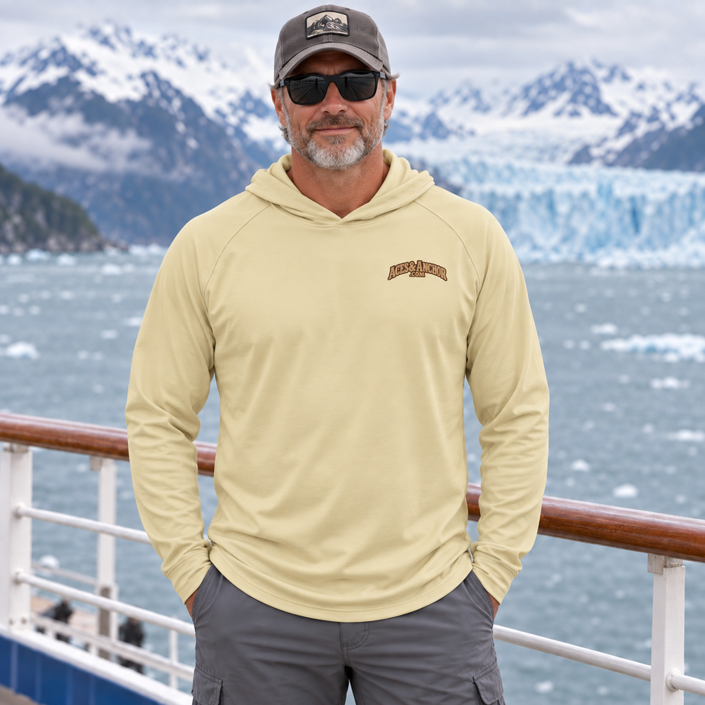 Man wearing Pale Yellow Alaska Town Sign performance hoodie, front view