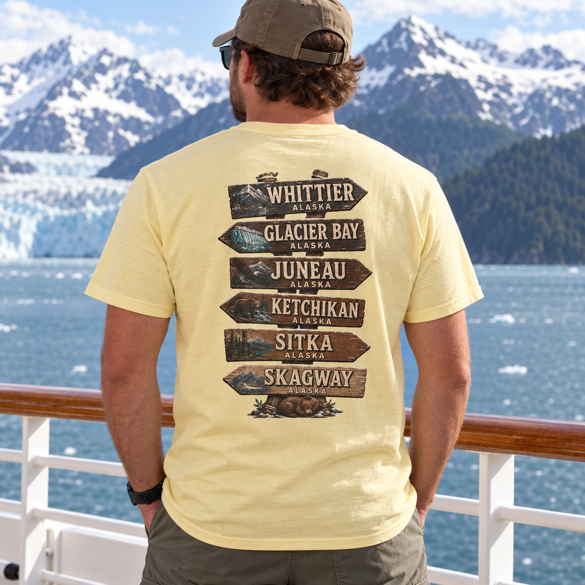 Male model wearing the Alaska Town Sign T-shirt, back view