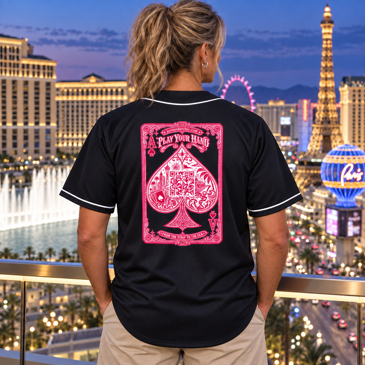Woman wearing Aces & Anchor Pink Ace black baseball jersey, back view